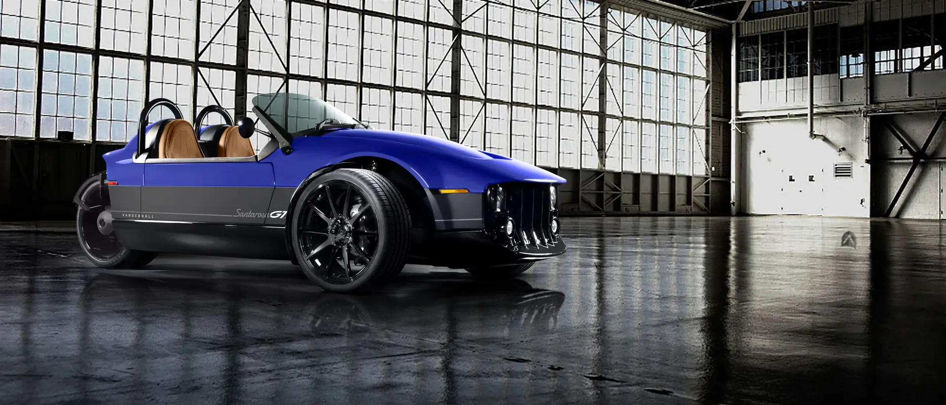 Blue Vanderhall Santarosa parked in an aircraft hangar